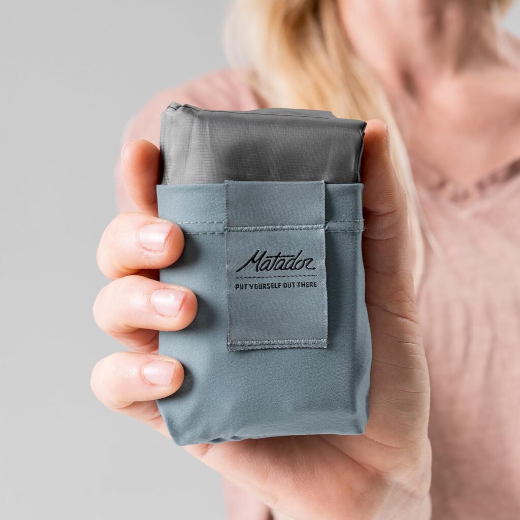 Compact weatherproof Matador pocket blanket for festival grounds